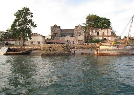 Country: Tanzania
Site: Pangani Historic Town
Caption: From the water: German-built Customs House, centre (behind the jetty pillar), with the Old Ibadhi Mosque on its left and the Al-Kasaby House on its right.  
Image Date: 22 March 2009
Photographer: Jeremy Cross
Provenance: 2010 Watch Nomination
Original: from Share File